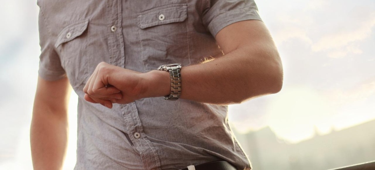 A person looking at a wristwatch.