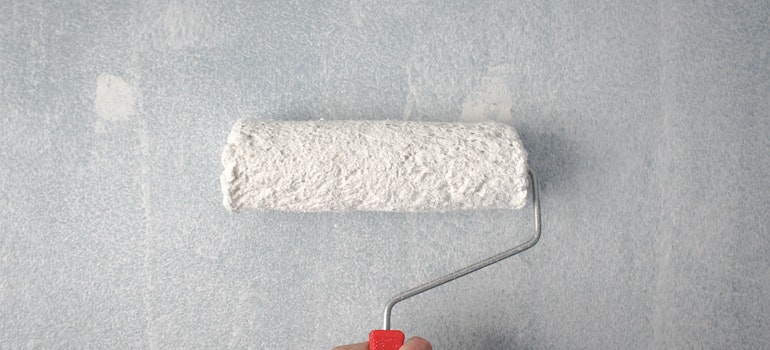 Paint roller on the wall