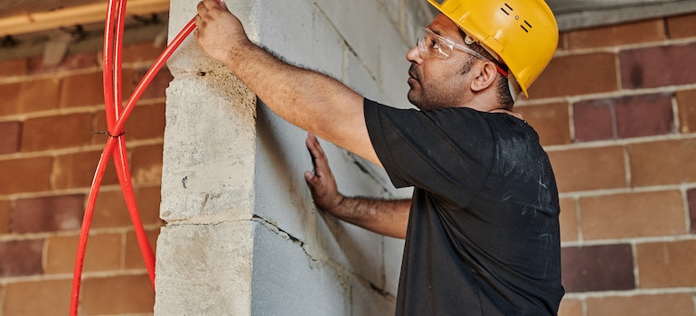 A man holding a wire