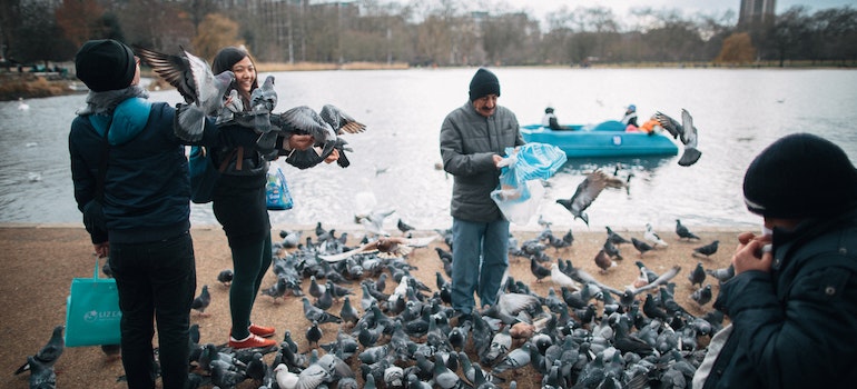 People feeding pigeons