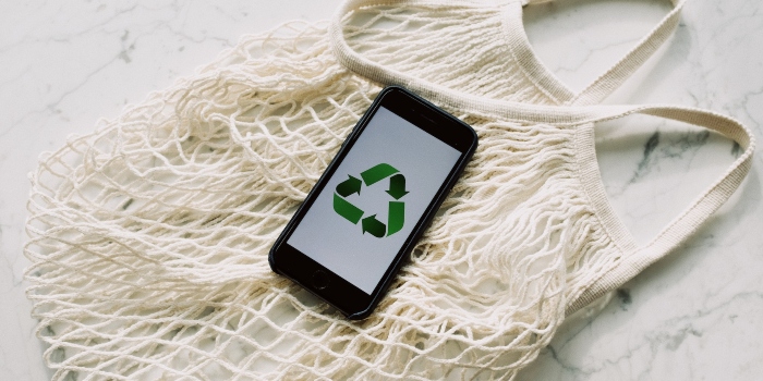iphone with sustainability logo
